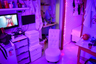 Inside the 'One-for-One' apartment/brothel of 40 year old working sex worker known by her on-line monikker 'Chubby Girl', in the Sham Shui Po district close to Mongkok. Under Hong Kong law, prostituti...