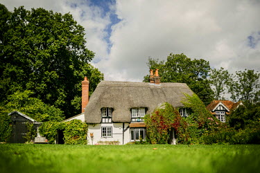A thatched, timber framed English country cottage in the village of West Tytherley dating from the early 15th century.