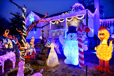 The Samuel family's house and front yard crowded with illuminated Christmas decorative figures. They have the most decorations in the neighbourhood. Nankee Samuel, originally from Trinidad, started th...