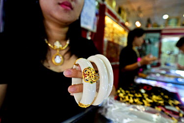 Ivory braclets on sale in Tha Phrachan market. Ornamental ivory is valued for both spiritual and aesthetic reasons and fetches high prices. Whilst trade in domestic ivory remains legal in Thailand, po...