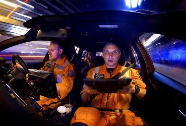 Paramedic Nathan Ward (left) and Dr. Marius Rehn navigate the streets of central London during an emergency call out.  London's Air Ambulance, also known as London HEMS (Helicopter Emergency Medical S...