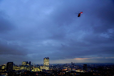 An Air Ambulance helicopter in the air over London. London's Air Ambulance, also known as London HEMS (Helicopter Emergency Medical Service), is a British registered charity that operates an air medic...