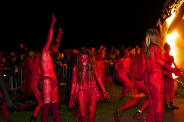 Semi naked dancers with bodies painted in red dance around a group of torch waving revellers at the annual Beltane Festival on Carlton Hill in Edinburgh.   The Beltane Festival is an annual event wh...