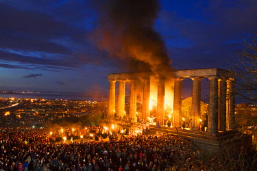 People gather in front of the National Monument on Carlton Hill in Edinburgh to celebrate the annaul Beltane Fire Festival.  The Beltane Festival is an annual event when winter is purged by fire. Fro...