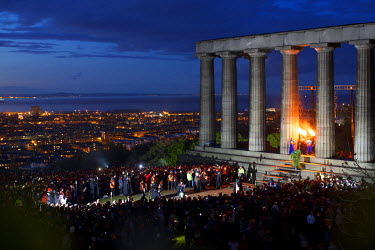 People gather in front of the National Monument on Carlton Hill in Edinburgh to celebrate the annaul Beltane Fire Festival.  The Beltane Festival is an annual event when winter is purged by fire. Fro...