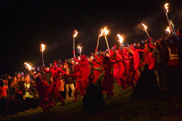 Semi naked dancers with bodies painted in red dance around a group of torch waving revellers at the annual Beltane Festival on Carlton Hill in Edinburgh.   The Beltane Festival is an annual event wh...