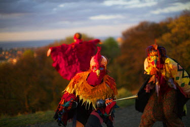 Revellers wearing colourful costumes, including bird masks and 'wings' gather on Cartlton Hill in Edinburgh for the annaul Beltane Fire Festival. The Beltane Festival is an annual event when winter is...