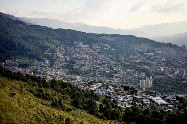 A view of Medellin from the top of Comuna 8. The city is building a 46-mile long concrete bike/walk 'greenbelt' surrounding the entire valley and intended to curb urban sprawl.  In recent years the ci...