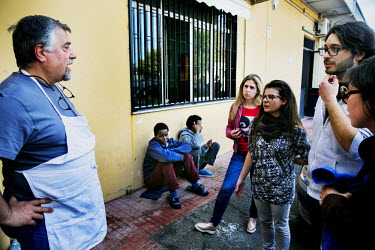Students arrive at offices of the Catholic charity Caritas where they have volunteered to help make up and distribute food parcels to the large numbers of migrants who gather at the city's train stati...