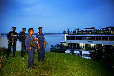Security officers guarding a ship where a reception for political and business VIPs was being held.
