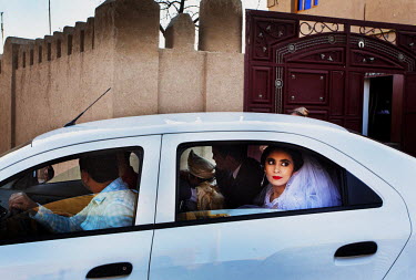 A bridal couple driving through Old Town. The city is now a UNESCO World Heritage SIte.