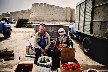 Market vendors selling vegetables near the old city walls. The city is now a UNESCO World Heritage SIte.