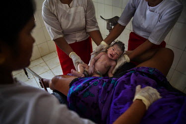 Arnuwar Bagun, 20, a Rohingya IDP, gives birth to a healthy boy in the 'Dapaing Emergency Hospital' in the Rohingya segregated area north of Sittwe. Most Rohingya IDPs give birth in the camps they liv...