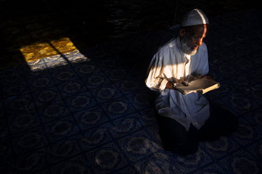 A Rohingya man prays in a temporary mosque in Thae Chaung IDP camp in the Rohingya segregated area north of Sittwe. The Rohingya are a Muslim people who have significant communities in several Asian c...