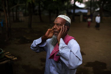 A Rohingya muezzin leads the call to prayer outside a mosque near Thae Chaung village in the segregated area north of Sittwe.  The Rohingya are a Muslim people who have significant communities in seve...