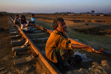 A blind Rohingya man begs for money as his sister and other dependants sit behind him in the segregated area north of Sittwe. The segregation has caused a near collapse of the economy for Rohingya who...