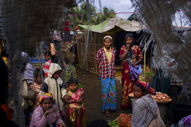 Rohingya IDPs and villagers shop in the market in Thae Chaung near, Sittwe. The Rohingya are a Muslim people who have significant communities in several Asian countries. Although originally from Bangl...