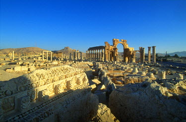 The ancient ruins of Palmyra. Palmyra (or Tadmor in Arabic) dates back to the Neolithic period and was first mentioned in the second millennium BC as a caravan stop. It later came under the Seleucid E...