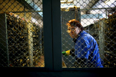 A female employee is seen through a wire window in a mine in Norilsk.  The city of Norilsk, in the far north of Russia's Krasnoyarsk region, was founded in the 1920s and today has a population of just...
