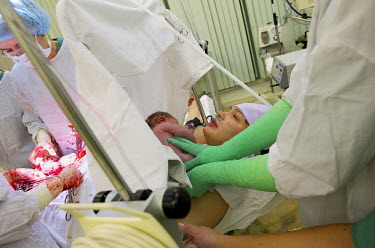 A woman gives birth in a hospital in Norilsk. Despite the harsh climate conditions in Norilsk and the environmental problems caused by industry the birth rate for this part of Russia is higher than th...