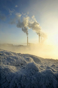 A view of smokestacks in Norilsk with thick ice visible in the foreground. The city of Norilsk, in the far north of Russia's Krasnoyarsk region, was founded in the 1920s and today has a population of...