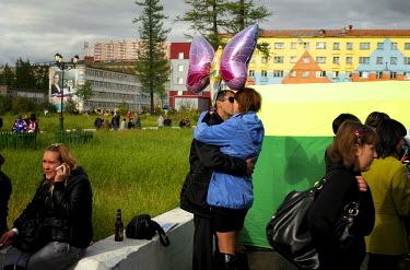 A couple kisses as people enjoy the round the clock light in Norilsk where, during the polar summer, the sun doesn't set for 45 days.  ps are organised locally with lots of activities.  The city of No...