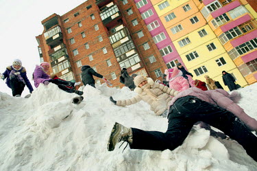 Children in Norilsk play on a large pile of snow that has been piling up over the winter months. The city is covered in snow for around 8 to 9 months a year. Each year around 10 tonnes of snow fall on...
