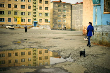 People walk the streets in a residential area in Norilsk in the evening during the polar summer when the sun doesn't set for over 45 days.  The city of Norilsk, in the far north of Russia's Krasnoyars...