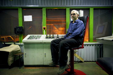 A portrait of a worker who remotely operates machines in one of the smelters belonging to Norilsk Nickel. To attract workers the company gives 90 days holiday a year and allows workers to retire at th...