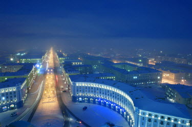 A view of the centre of Norilsk on a cold and misty evening. The city was planned to be an 'ideal' city with a simple layout. The oldest buildings are typically Stalinist in style.   The city of Noril...