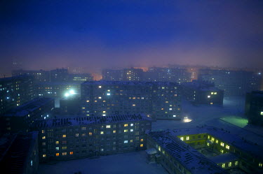 A view of housing blocks in Norilsk at dusk.   The city of Norilsk, in the far north of Russia's Krasnoyarsk region, was founded in the 1920s and today has a population of just over 175,000. In its ea...