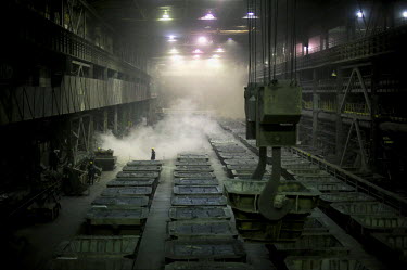 A worker stands in the central area of one of the smelters belonging to Norilsk Nickel.  The complex consists of three plants - the nickel plant, the copper plant and 'Nadezhda' ('Hope') plant built i...