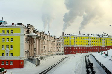A view of older buildings lining a street in Norilsk on a snowy day.   The city of Norilsk, in the far north of Russia's Krasnoyarsk region, was founded in the 1920s and today has a population of just...