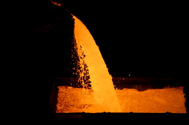Molten metal is poured into a container in one of the Smelters belonging to Norilsk Nickel.  The complex consists of three plants - the nickel plant, the copper plant and 'Nadezhda' ('Hope') plant bui...