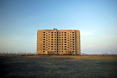 An unfinished multi storey residential building that was started during the Soviet Union but was abandoned in the early 1990s due to economic and political changes in Russia.   The city of Norilsk, in...