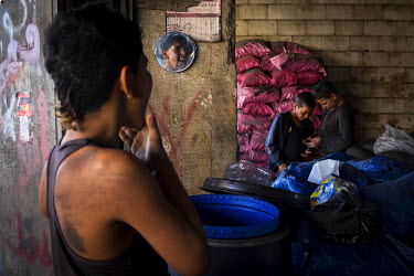 Anas Ezza, 12, washes his face after finishing work at a charcoal shop Bebnine. Anas is from Homs (Syria) and came to Lebanon three months earlier with his family, they live in a tented settlement beh...