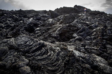 An old solidified lava stream running into the North Atlantic Ocean at Timanfaya national park.