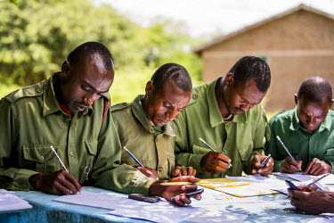 Village game scouts (VGS) on a training exercise in Burunge Wildlife Management Area (WMA). WMAs are community owned and managed conservation areas. Located adjacent to national parks and other game p...