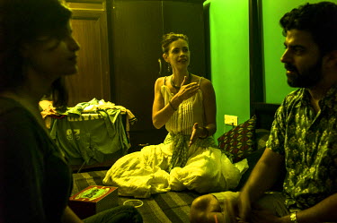 Indian born French actress, Kalki Koechlin (centre) with her friends from the Bombay film industry at a house party in an apartment in Mumbai.