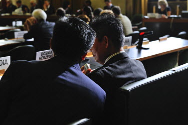 Cambodian diplomats at the Conference on Disarmament confer together during a session mainly devoted to discussion of the year's annual report to the United Nations General Asembly.  'The meeting wa...