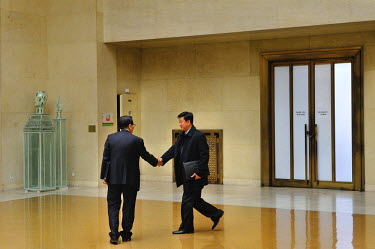 In a rare event North and South Korean diplomats at the Conference on Disarmament shake hands as they pass each other in the hallway outside the CD. The Conference on Disarmament, established in 1979,...
