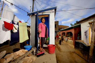 Narindra, 29, housewife, in the toilets built by her mother. Narindra says : 'Thanks to my mother, who built the toilets following the advice, I can find a bit more of the comfort and hygiene I had wh...