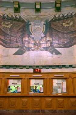A Soviet era design inlaid above ticket booths in Ploschad Revolyutsii (Revolution Square) Metro Station. This station is perhaps the best known as it serves Red Square. The station features Armenian...