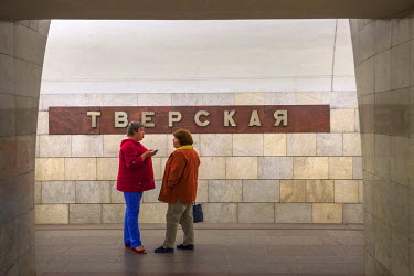 Two women talking at Tverskaya Metro Station.