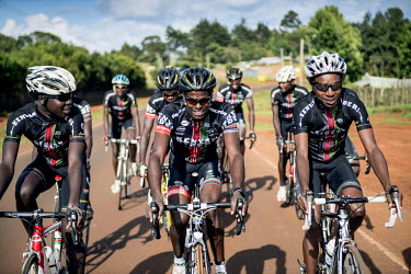 The Kenyan Riders, a Kenyan cycling team, train along the road between Eldoret and Iten, a small town in the highlands on the edge of the Great Rift Valley at an altitude of 2400 metres, a perfect loc...