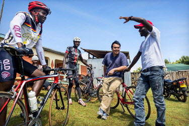 The Kenyan Riders, a Kenyan cycling team, discuss their training schedule with their Singaporean manager Nicholas Leong (The team is trained by Australian Simon Blake) while gathered at their training...