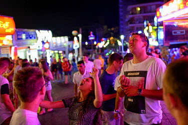 A young woman shouts in the street. Thousands of young tourists visit Magaluf each year seeking cheap alcohol and fun. The new mayor Alfonso Rodriguez, has promised to clamp down on the drunken behavi...
