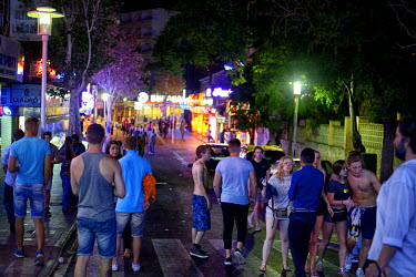 A crowd of youths on the street. Thousands of young tourists visit Magaluf each year seeking cheap alcohol and fun. The new mayor Alfonso Rodriguez, has promised to clamp down on the drunken behaviour...