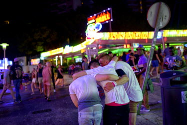 Three drunken youths stagger along supporting each other. Thousands of young tourists visit Magaluf each year seeking cheap alcohol and fun. The new mayor Alfonso Rodriguez, has promised to clamp down...