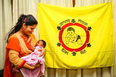 A mother and her child at Dhaka Shishu (Children's) Hospital to receive vaccines at the launch of the Expanded Program on Immunisation (EPI). The pneumococcal vaccine (PCV), which protects against one...